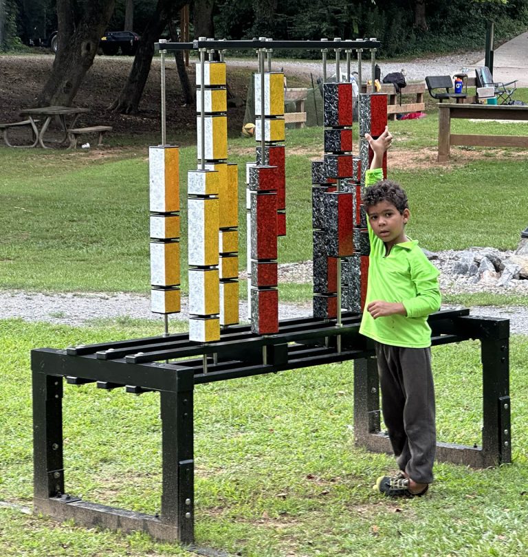 young fellow arranging a sculpture